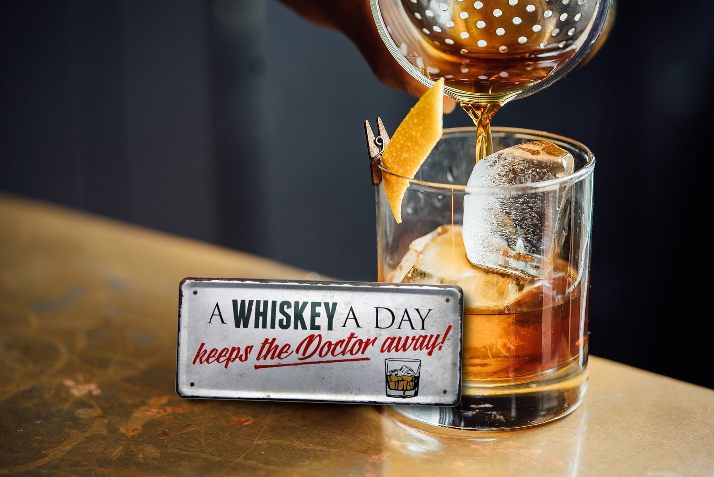 Tin sign ''A whiskey a day keeps the doctor away'' 28x12cm