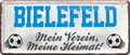 4252024238075		 ''Bielefeld Mein Verein, meine Heimat'' Schilderstore24 Blechschilder sind perfekt als Geschenk zu Weihnachten, Geburtstage, Feiern, Partys, Grillabende, Namenstag, Feiertag, Mädelsabend, Hochzeit. Jederzeit stilvoll im Wohnzimmer, Partykeller, Garage, Praxis, Büro, Café, Hauseingang Fußball Mannschaft Verein Bolzen Ball sport liga kicken stadion freizeit