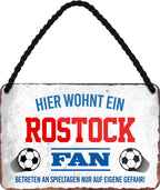 4252024203592 Schilderstore24 Schilderstore24 Blechschilder sind perfekt als Geschenk zu Weihnachten, Geburtstage, Feiern, Partys, Grillabende, Namenstag, Feiertag, Mädelsabend, Hochzeit. Jederzeit stilvoll im Wohnzimmer, Partykeller, Garage, Praxis, Büro, Café, Hauseingang Fußball Mannschaft Verein Bolzen Ball sport liga kicken stadion freizeit	 ''Rostock Fan''		18x12cm