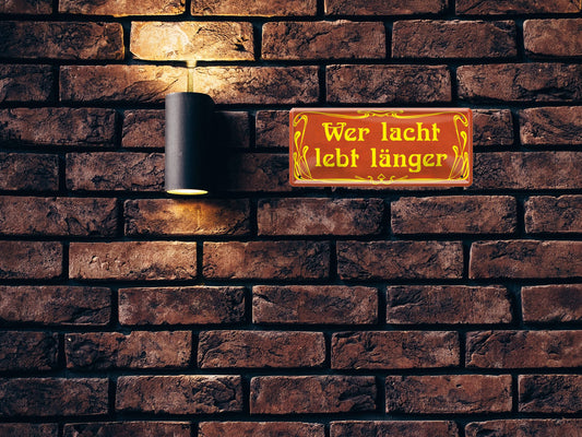 Tin sign "He who laughs lives longer" 28x12cm